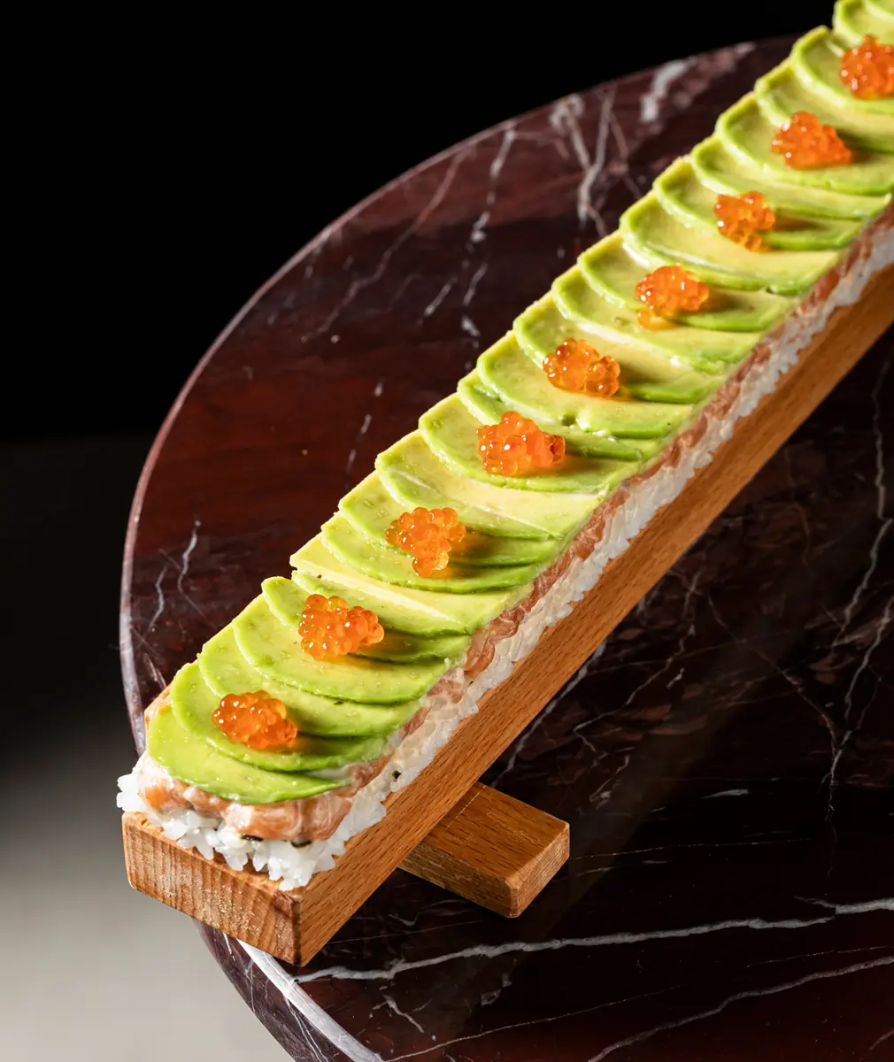 Oshizushi with salmon, avocado and red caviar