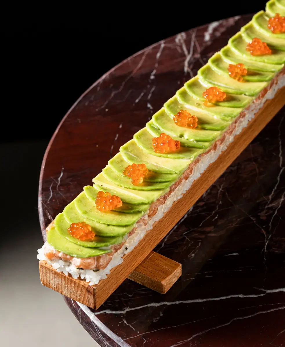Oshizushi with salmon, avocado and red caviar