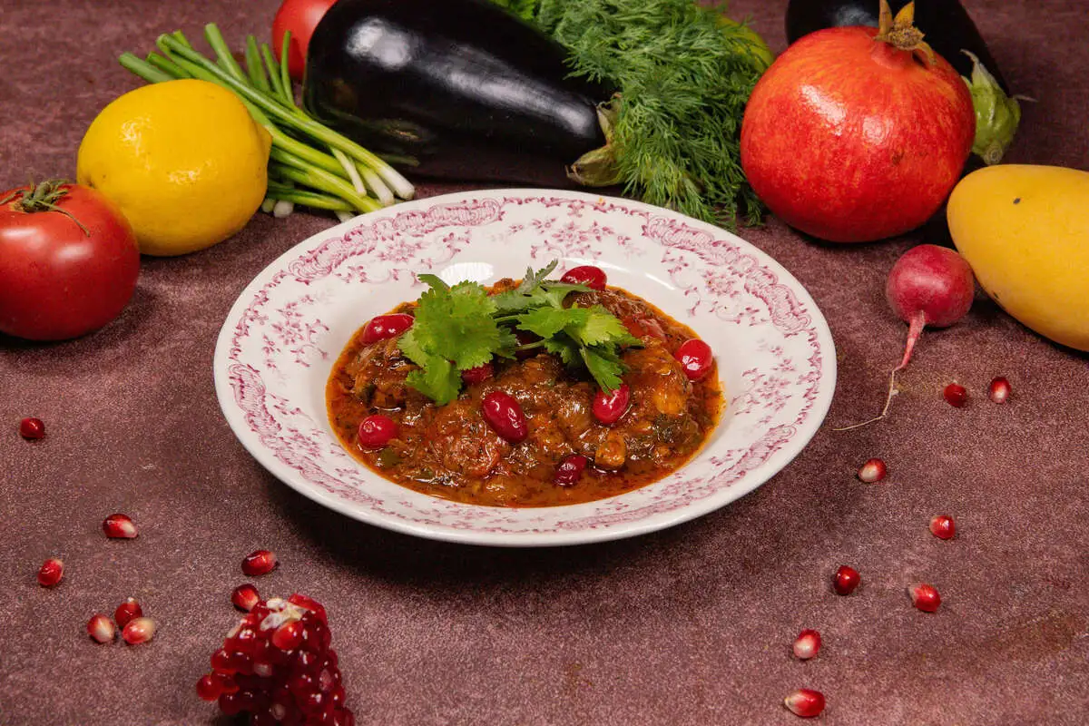 Чахохбили из курицы с кизилом, спелыми томатами и зеленью